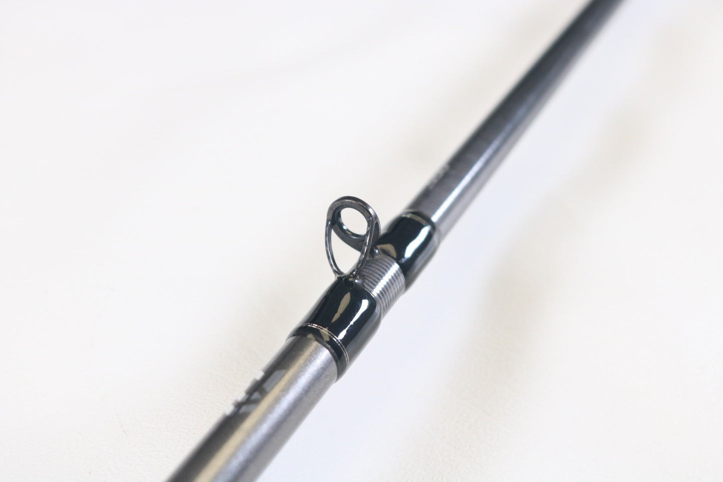Close-up of a Daiwa Tatula Elite AGS TTEL791HFB-AGS Long Cast Frog 7'9" Heavy Used Casting Rod in very good condition, highlighting the line guide—ideal for showcasing your Daiwa gear in our Rod and Reel Trade-In Program for store credit.