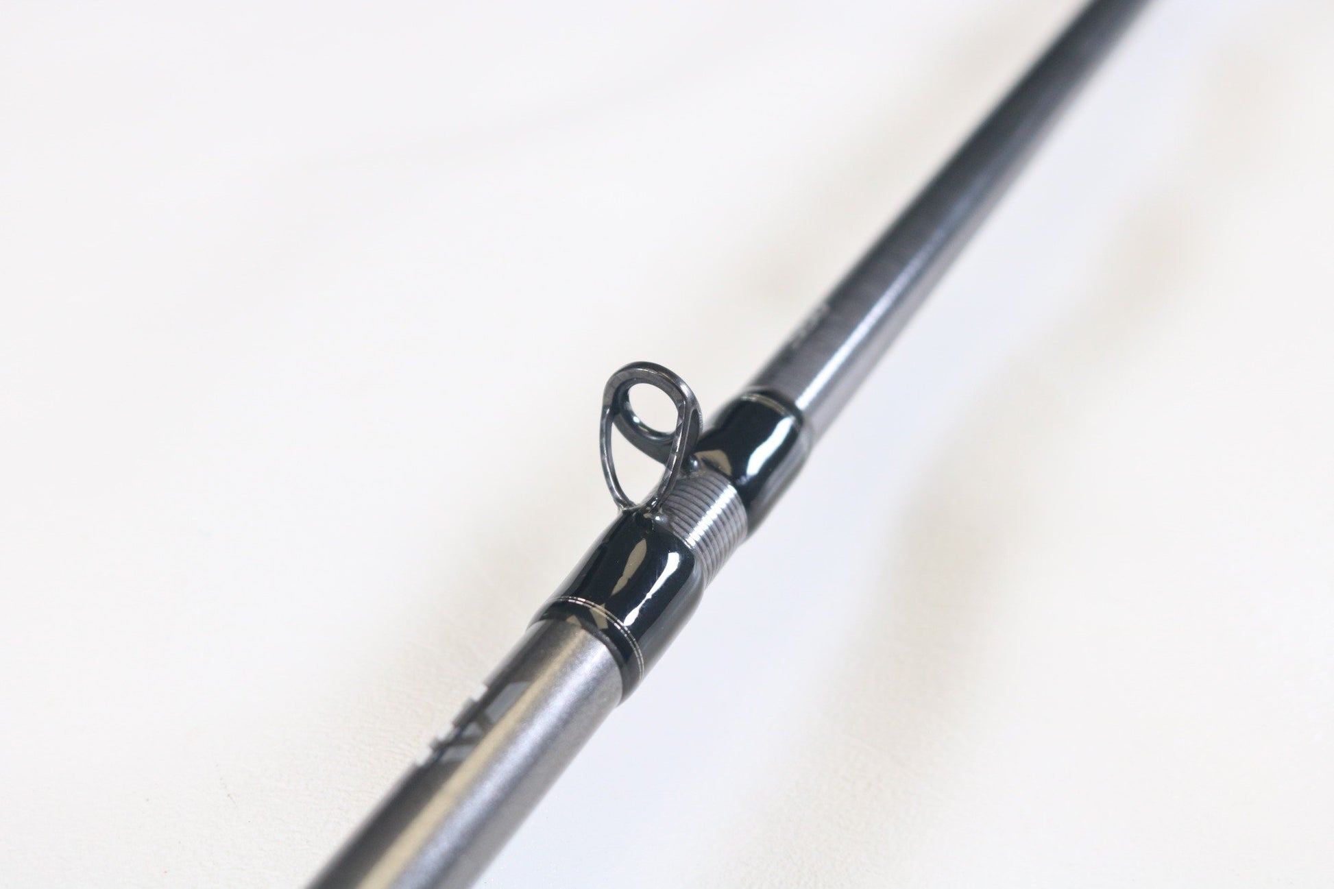 Close-up of a Daiwa Tatula Elite AGS TTEL791HFB-AGS Long Cast Frog 7'9" Heavy Used Casting Rod in very good condition, highlighting the line guide—ideal for showcasing your Daiwa gear in our Rod and Reel Trade-In Program for store credit.