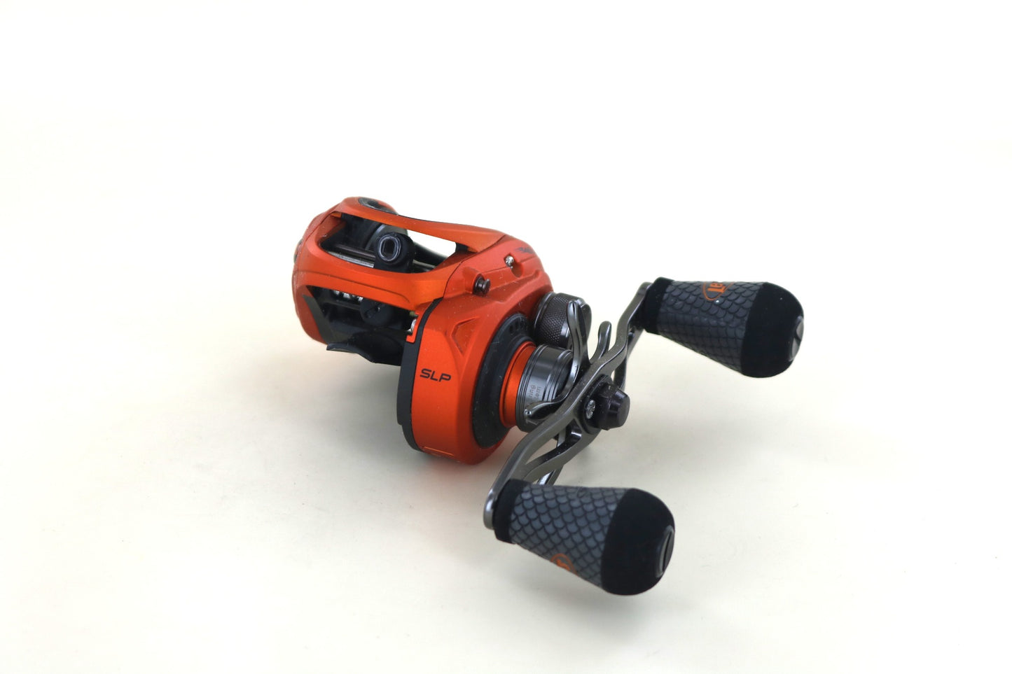 A close-up of the Lew's Mach Crush MCR1SHLA 7:5:1 Left Handed Casting Reel in mint condition, featuring black textured handles—perfect for those trading in a rod and reel or seeking top-quality used gear from Lew's.