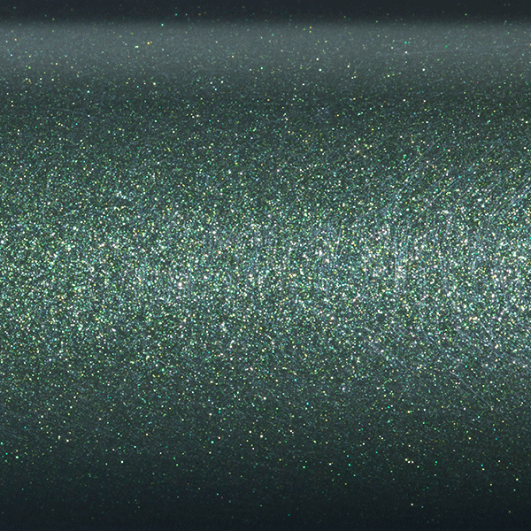A close-up of a shimmering, textured surface with green and silver glitter evokes the sparkling, iridescent finish of the St. Croix Legend Elite 7'6" Medium Light Spinning Rod | ES76MLXF.
