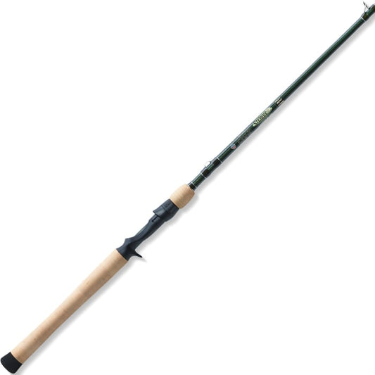 The St. Croix Legend Elite 7'4" Heavy Casting Rod (EC74HF) by St. Croix features a light cork handle, black reel seat, and a long green high-modulus SCVI graphite blank, positioned diagonally on a white background.