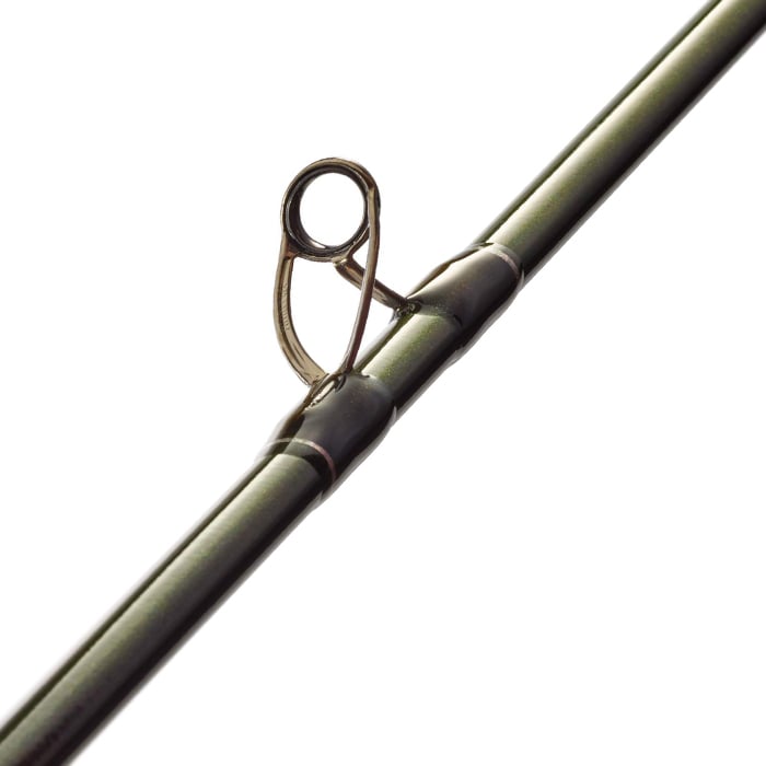 Close-up of a dark green St. Croix Legend Elite Musky 8'0" Medium Heavy Casting Rod (LEM80MHF) shows an eyelet, a metal guide for fishing line—perfect for musky anglers seeking St. Croix's advanced performance.