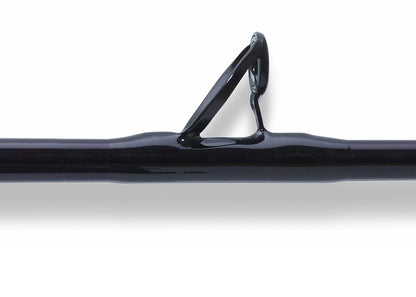 Close-up of a St. Croix Mojo Salt 6'6" Medium Conventional Rod (MSWC66MF) in black, highlighting one line guide against a white background.