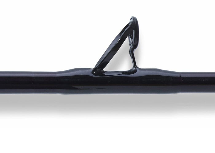 Close-up of a black St. Croix Mojo Salt 7'6" Heavy Conventional Rod (MSWC76HMF), highlighting a single line guide ring against a white background.