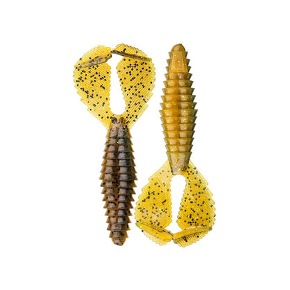 Two Reaction Innovations Spicy Beaver 4.0 soft plastic lures in yellow and brown with black speckles, ribbed bodies, and flared wing-like tails are displayed side by side on a white background—perfect as swim jig trailers.