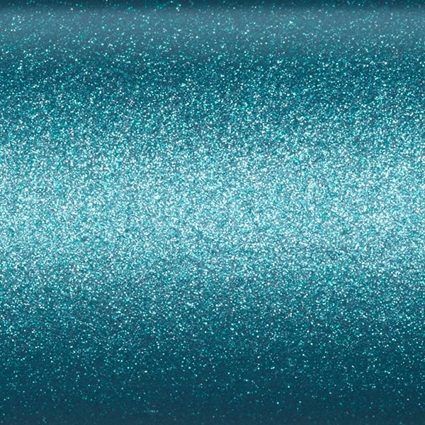A close-up view of a teal glittery surface, dense with fine sparkling particles that create a shimmering effect—reminiscent of the high-modulus SCIII graphite found in the St. Croix Avid Inshore 7'0" Medium Spinning Rod (VIS70MF).