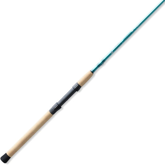 The St. Croix Avid Inshore 6'6" Medium Heavy Spinning Rod (VIS66MHF) features a teal rod blank, black reel seat, and light brown cork handle—your perfect saltwater fishing companion. Shown on a white background.