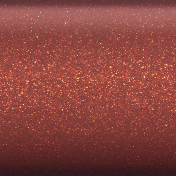 Close-up of the St. Croix Imperial USA 9'0" 10wt Fly Rod surface, revealing fine, shimmering gold and orange glitter particles evenly distributed across its rich reddish-brown finish.
