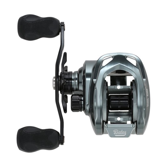 Top-down view of a metallic gray Bates Fishing Co. Hundo'50 Casting Reel 6.3:1 LH (BRH50LH631) with two black handles, center spool, and the "Bates Fishing Co." brand name visible on the front.