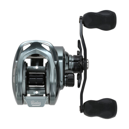 A silver and black Bates Fishing Co. Hundo'50 Casting Reel 6.3:1 RH, shown from above with dual handles, visible spool, adjustment knobs, and the Bates Fishing Co. logo—crafted for anglers seeking style and precision.