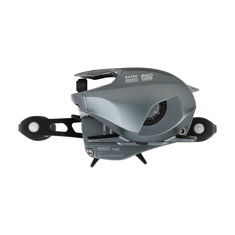 A metallic gray Bates Fishing Co. Hundo'50 Casting Reel 6.3:1 RH (BRH50RH631) with visible gears and a winding handle, shown against a white background.
