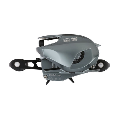 A metallic gray Bates Fishing Co. Hundo'50 Casting Reel 6.3:1 RH (BRH50RH631) with visible gears and a winding handle, shown against a white background.