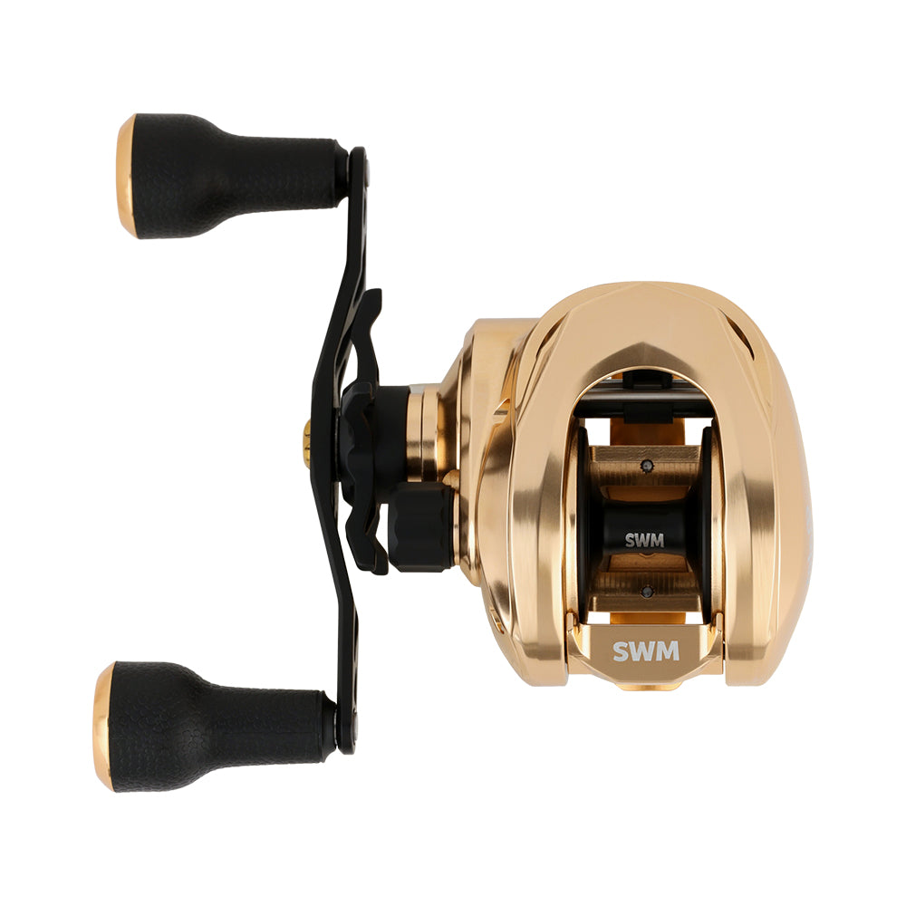 The Bates Fishing Co. GOAT SWM LE Knox Gold Casting Reel 7.1:1 LH features a gold and black finish, dual black handles, and a compact, sleek design, shown from above on a plain white background.