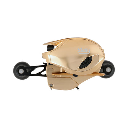 The Bates Fishing Co. GOAT SWM LE Knox Gold Casting Reel 5.2:1 RH features a sleek, modern design in gold CNC machined aluminum with two black side wheels, shown against a plain white background.