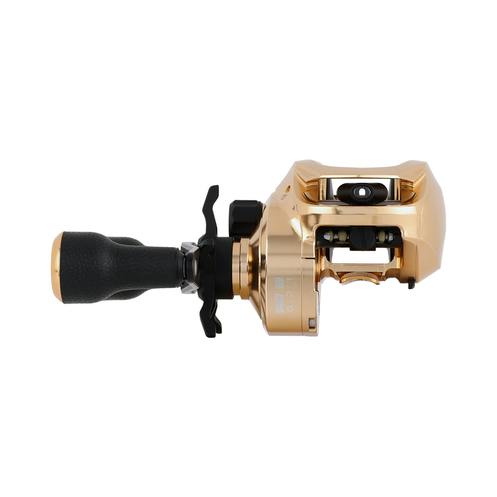 The Bates Fishing Co. GOAT SWM LE Knox Gold Casting Reel 5.2:1 RH features gold and black CNC-machined aluminum, a large handle, and detailed adjustment knobs, shown from the side against a white background.
