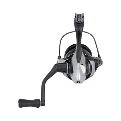 A front view of the Shimano Exsence B Spinning Reel 2500XGB (25EXS25XGB) by Shimano, featuring a metallic finish, left-side black handle, and central spool. Ideal for finesse fishing, shown isolated on a white background.