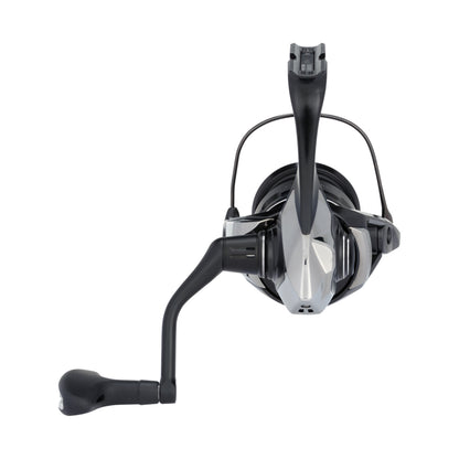 A close-up, front view of the Shimano Exsence B Spinning Reel C3000MHGB 5.8:1 by Shimano, shown in silver and black with InfinityLoop technology, left-side crank handle, and visible spool and bail arm against a white background.