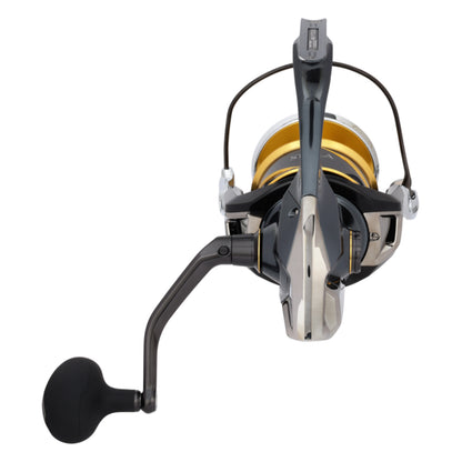 The Shimano Stella SW D Spinning Reel 25000PGD 4.4:1 by Shimano features a black handle, gold spool, and metallic body, pictured from above on a white background.