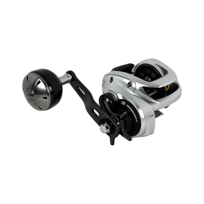 The Shimano Tranx 400 B Casting Reel 7.6:1 RH Power Handle (TRX400HGB), in silver and black, is ideal for saltwater or heavy-duty fishing and is displayed on a plain white background.