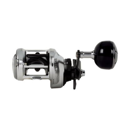 The Shimano Tranx 400 B Casting Reel (TRX400HGB) features a silver and black open frame design with a large power handle, shown on a white background.