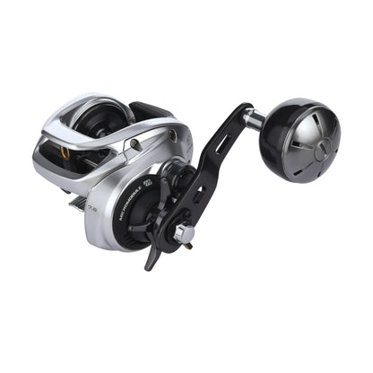 The Shimano Tranx 400 B Casting Reel 7.6:1 LH Power Handle (TRX401HGB) features a silver and black finish, metal gears, and a compact modern design by Shimano, shown on a plain white background.