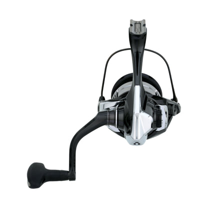 Front view of the Shimano Vanquish Spinning Reel 4000XGC 6.2:1 (VQ4000XGC) by Shimano, shown with a black and silver finish, curved handle, ergonomic grip, and MagnumLite technology on a white background.