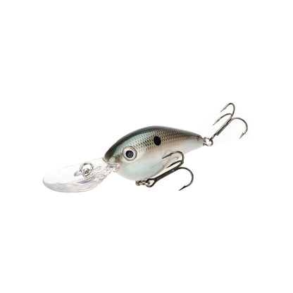 The Strike King 8XD Crankbait, shaped like a small fish with a greenish-grey body, black spot, two treble hooks, and clear plastic lip for deep diving, is ideal for bass anglers seeking top Strike King performance.