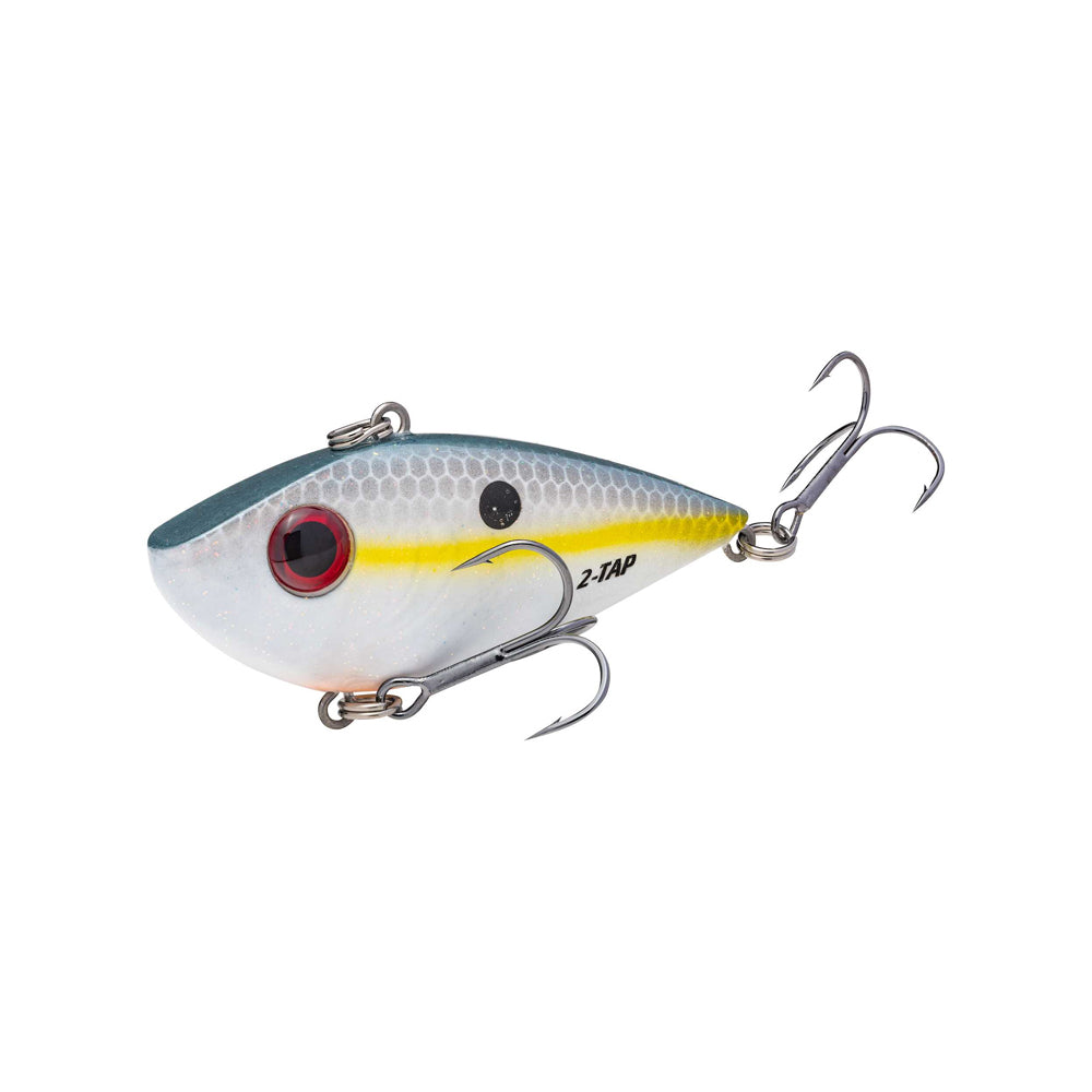 The Strike King Red Eye Shad Tungsten 2 Tap Lipless Crankbait 3/4oz features a white body with yellow stripe, large red eye, two treble hooks, and "2-TAP" on its side. Tungsten technology creates a unique sound to attract fish.