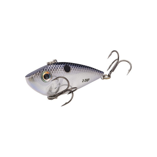 The Strike King Red Eye Shad Tungsten 2 Tap Lipless Crankbait 3/4oz features a silver and blue finish, realistic scales, two treble hooks, a large eye, and "2-TAP" text on the side, shown on a white background.