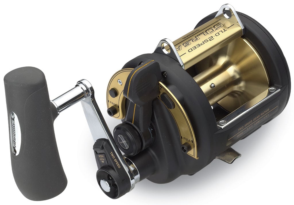 A close-up of the Shimano TLD 2-Speed 50IILRSA Lever Drag Fishing Reel shows its side handle, metallic accents, A-RB bearings, and clear Shimano branding—designed for deep-sea or heavy-duty fishing.
