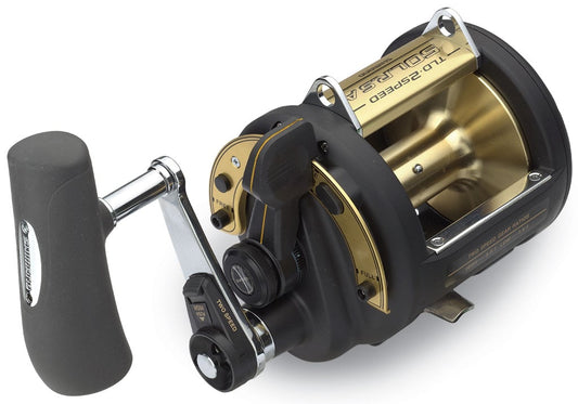 A close-up of the Shimano TLD 2-Speed 50IILRSA Lever Drag Fishing Reel shows its side handle, metallic accents, A-RB bearings, and clear Shimano branding—designed for deep-sea or heavy-duty fishing.
