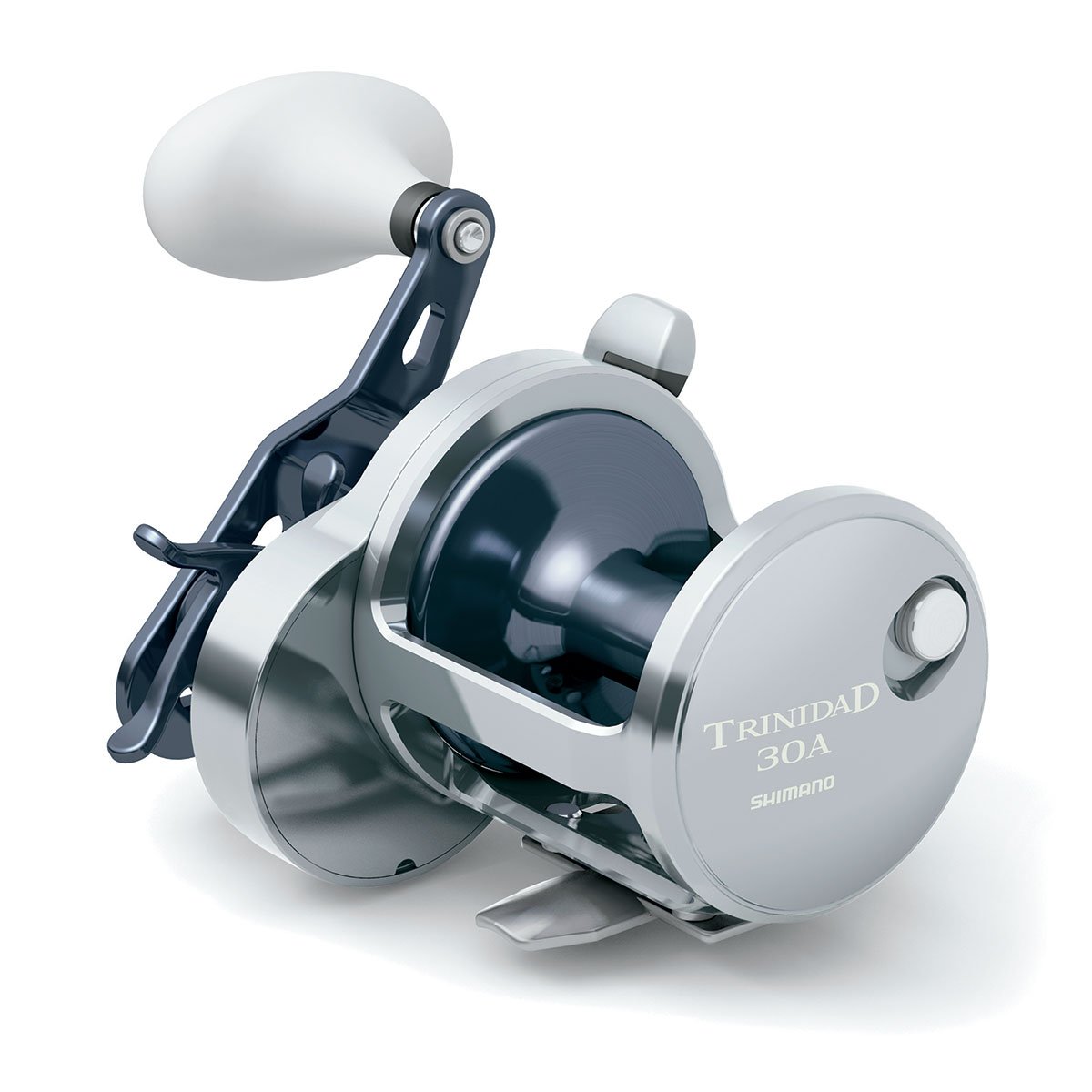The Shimano Trinidad 30A Conventional Reel features a silver finish, large white handle, High Efficiency Gearing, and "Trinidad 30A Shimano" printed on the side plate.