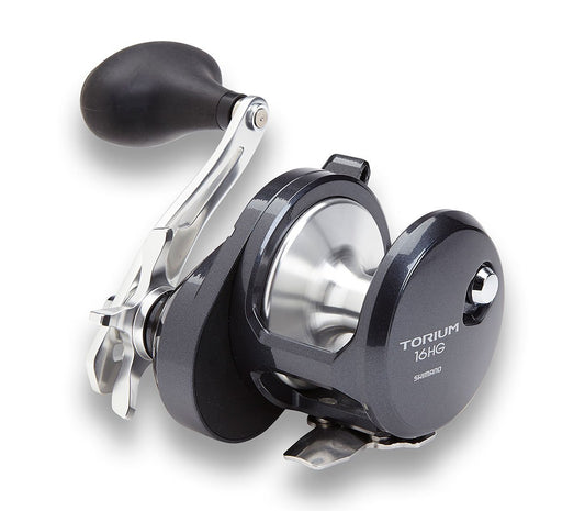 A close-up of the Shimano Torium 16HGAL Left Hand Star Drag Fishing Reel by Shimano, showing its metallic gray body, ergonomic black handle, and shiny spool against a white background.